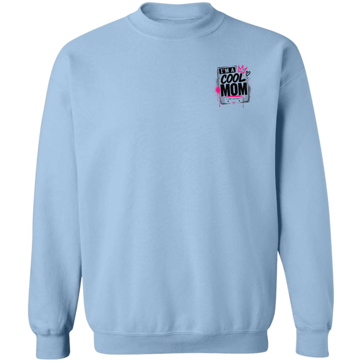 Person wearing a Light Blue sweatshirt with a graphic design Say's I'm A  Cool Mom on a city street.