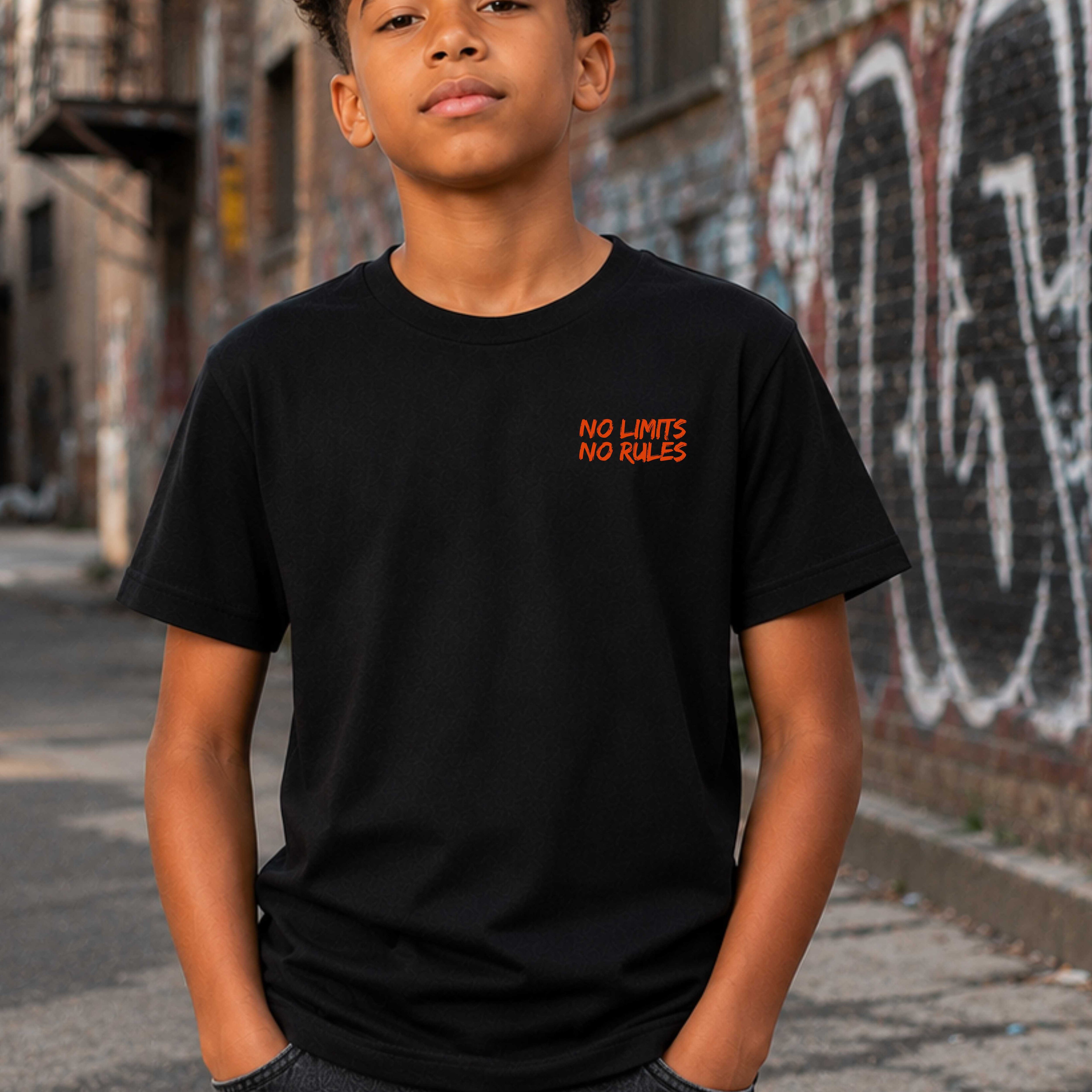 Young person wearing a black t-shirt with 'NO LIMITS NO RULES' text in red, standing in an urban setting with graffiti.