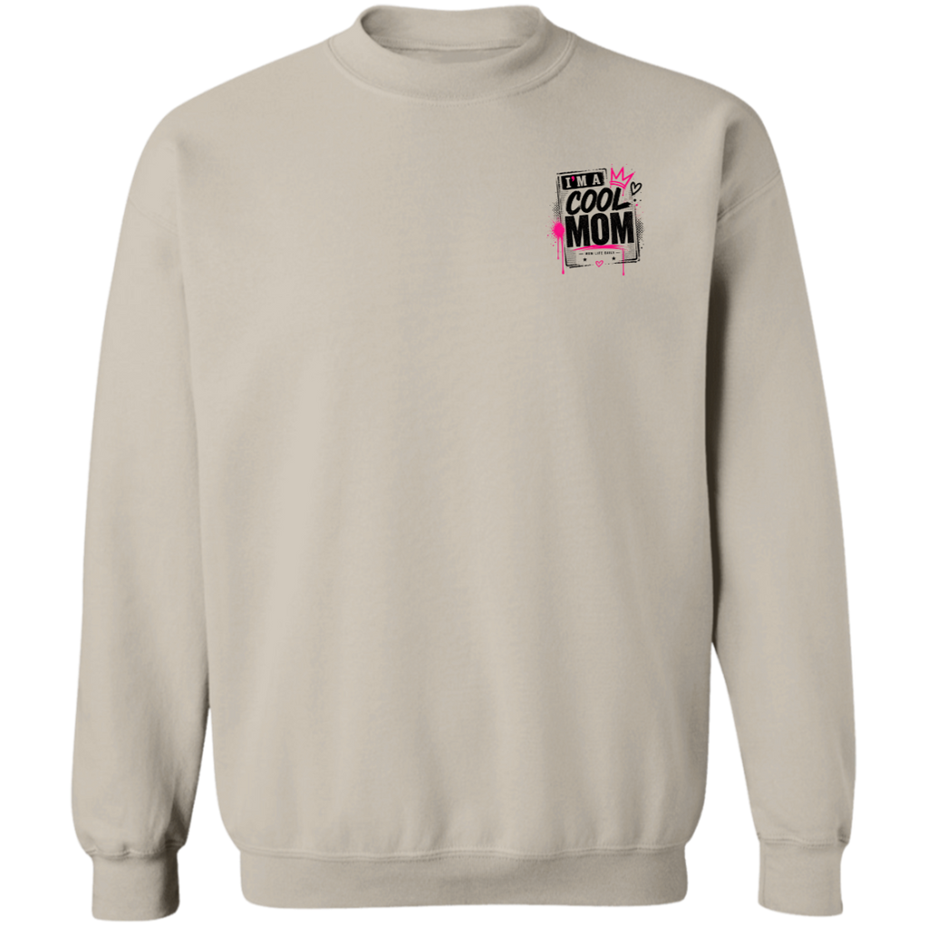 Person wearing a Sand sweatshirt with a graphic design Say's I'm A  Cool Mom on a city street.