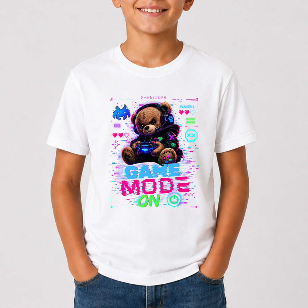 Child wearing a white t-shirt with a teddy bear graphic and 'Game Mode On' text on a plain background