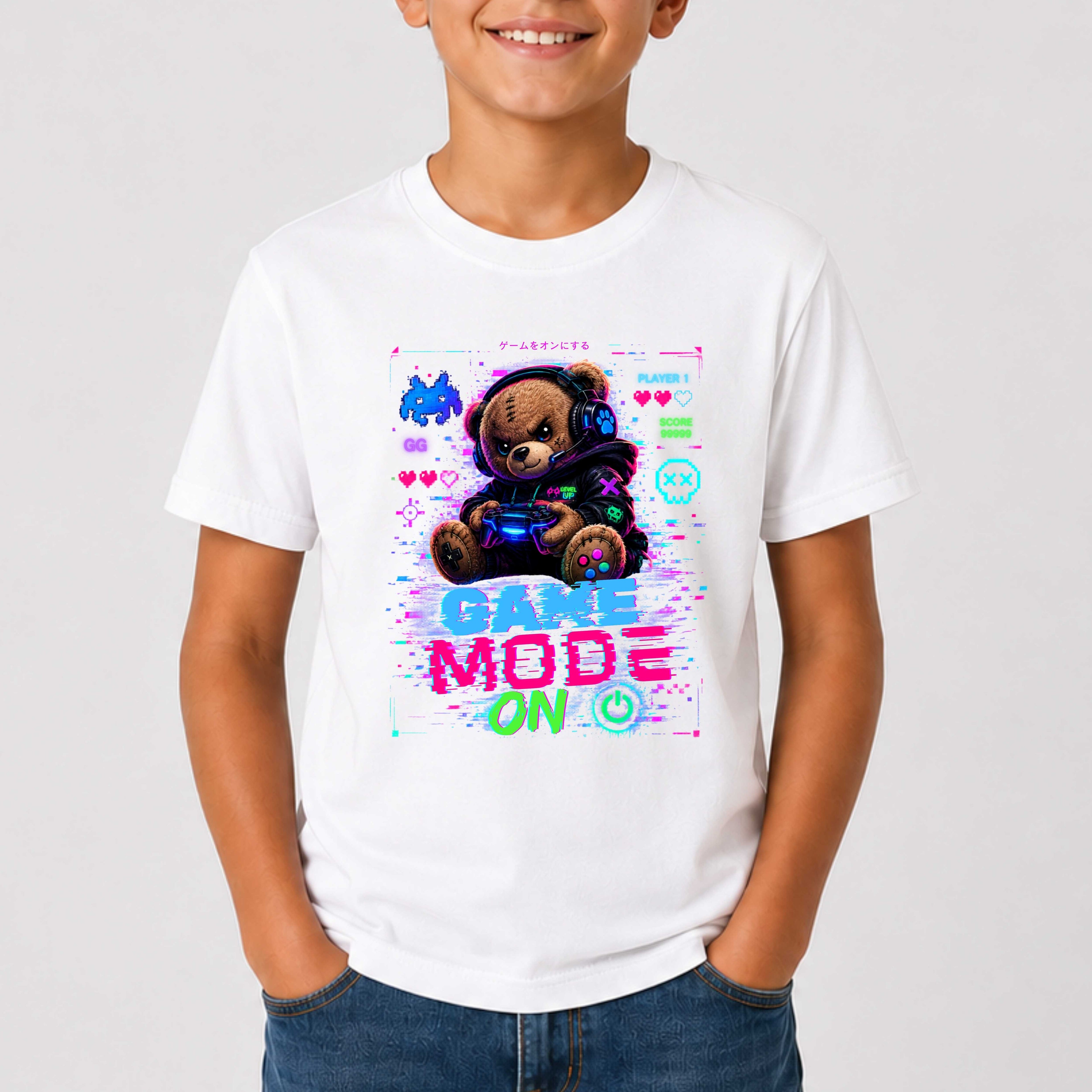 Child wearing a white t-shirt with a teddy bear graphic and 'Game Mode On' text on a plain background