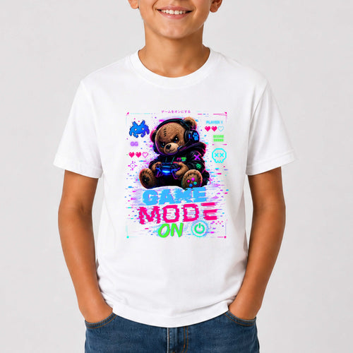 Child wearing a white t-shirt with a teddy bear graphic and 'Game Mode On' text on a plain background